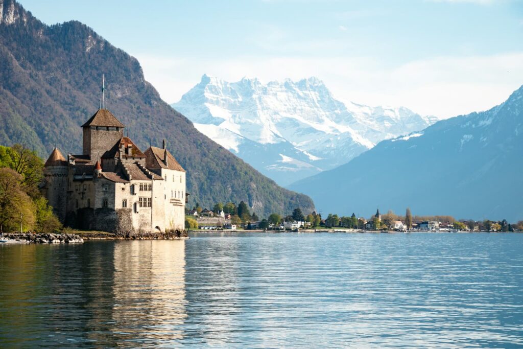 Chillon Castle on Lake Geneva, with the snow-covered Dents du Midi behind