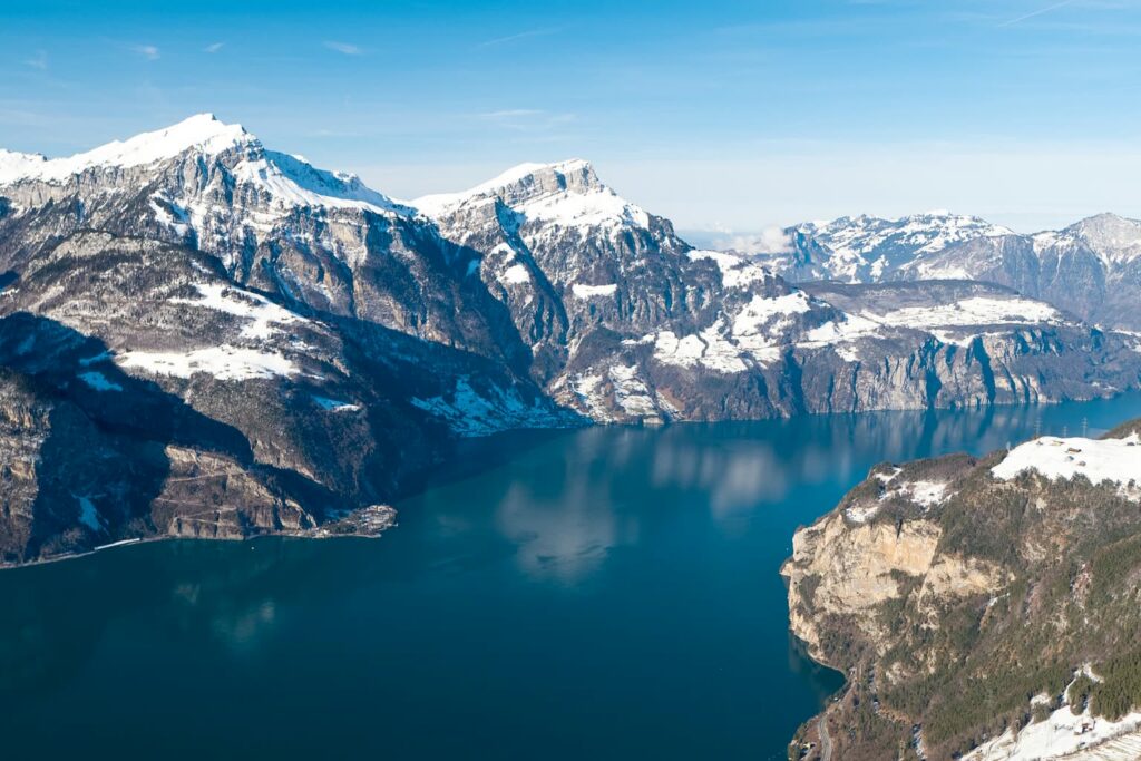 Lake Uri between snow-covered mountains, seen from the Eggberge above Altdorf